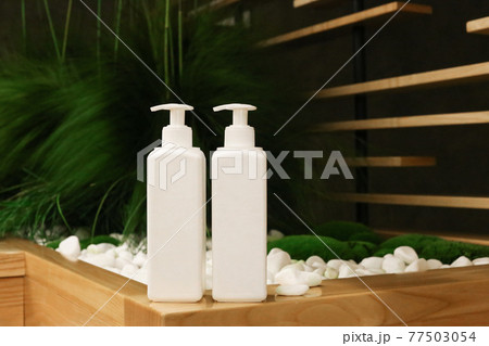 White Plastic dispenser bottles with body cream 77503054