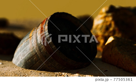 old wooden barrel at sand beach old wooden barrel at sand beach 77505361