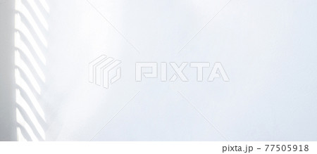 Shadow background. Sunlight architecture abstract background with light, black shadow overlay from window on white texture wall. Product presentation, backdrop and mockup, summer seasonal concept. 77505918
