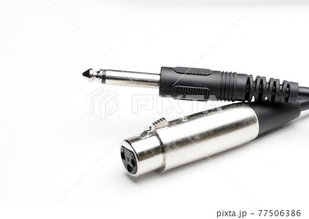 Audio cable with XLR and TRS jack connectors for microphones and professional audio equipment on a white background Audio cable with XLR and TRS jack connectors for microphones and professional audio equipment on a white background 77506386