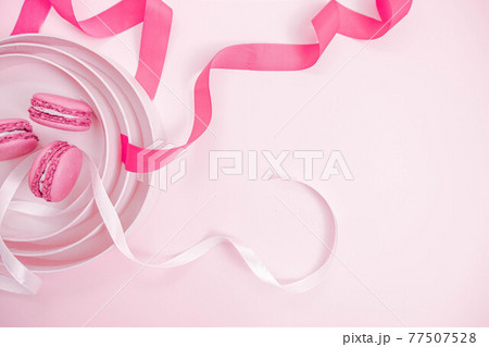 Valentine's Day. Pink background with macaroons. Ribbon heart, two hearts. Soft pastel love. Flat lay, top view. Valentines Day Valentine's Day. Pink background with macaroons. Ribbon heart, two hearts. Soft pastel love. Flat lay, top view. Valentines Day 77507528