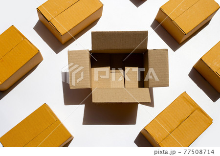 Brown cardboard boxes on white background. Brown cardboard boxes on white background. 77508714