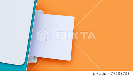 Printer and paper on orange background. 77508733