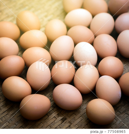 Fresh farm eggs on a wooden background Fresh farm eggs on a wooden background 77508965