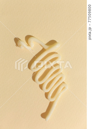 Cosmetic cream texture on neutral background 77509800