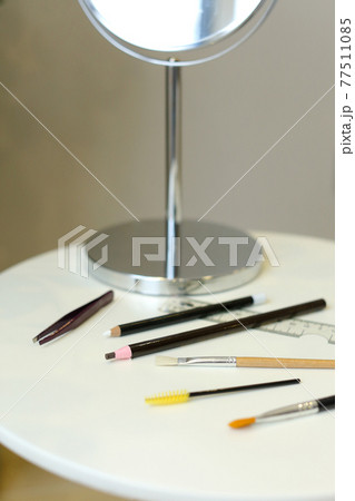 Set of professional cosmetic: make-up brushes, lipstick and brow pencil Set of professional cosmetic: make-up brushes, lipstick and brow pencil 77511085