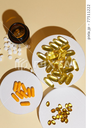 omega fish oil dietary supplements on neutral background 77511222