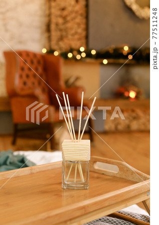 Aromatherapy reed diffuser air freshener on relaxed spa background 77511248