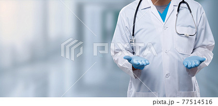 Doctor open two hands and show both empty area on palm sign with hospital blur background in blue tone, for donation speed for life Doctor open two hands and show both empty area on palm sign with hospital blur background in blue tone, for donation speed for life 77514516