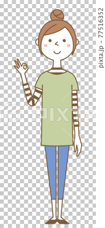 A young woman giving an OK sign 77516352