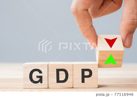 business man Hand change wood cube block with GDP text (Gross domestic product) to UP and Down arrow symbol icon. Financial, Management, Economic and business concepts business man Hand change wood cube block with GDP text (Gross domestic product) to UP and Down arrow symbol icon. Financial, Management, Economic and business concepts 77516946