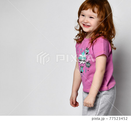 Shy smiling cutie smiling little toddler girl in Shy smiling cutie smiling little toddler girl in 77523452