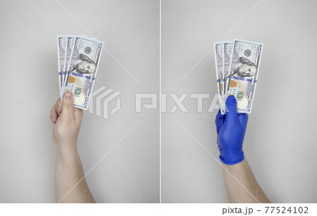 Hand in glove holds dollars with germs. The concept of dirty money as a carrier of bacteria and viruses 77524102