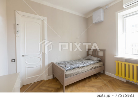 Simple interior of modern bedroom with bed 77525933