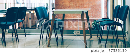 Coworking room space with tables and chairs 77526150