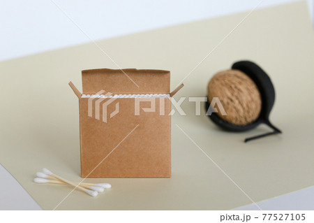 Bamboo cotton swabs on orange table. Zero waste, plastic free lifestyle concept Bamboo cotton swabs on orange table. Zero waste, plastic free lifestyle concept 77527105