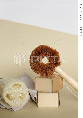 Bath accessories concept. Natural beige sponge Luffa cylindricaon with eco toilet cleaner tool on neutral beige background. Zero waste, eco friendly Bath accessories concept. Natural beige sponge Luffa cylindricaon with eco toilet cleaner tool on neutral beige background. Zero waste, eco friendly 77527349