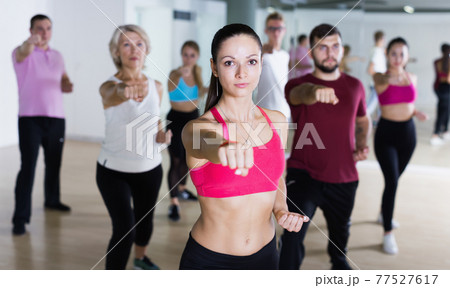 Active people of different ages practice sport dance 77527617
