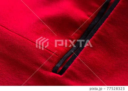 Red stylish jacket with pocket, background. Stylish clothes, macro Red stylish jacket with pocket, background. Stylish clothes, macro 77528323