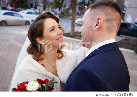 portrait of loving and happy newlywed. help of coordinator of celebration.  77530399