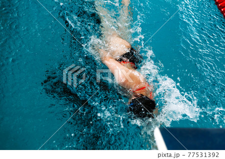 swimming in the pool at the swimming stadium 77531392