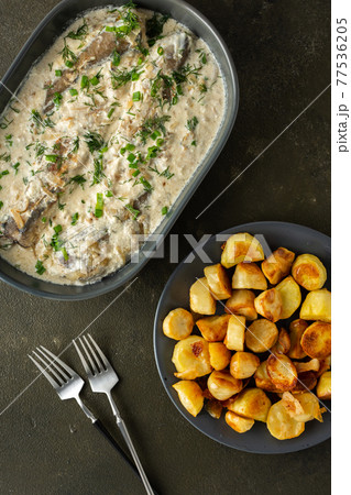 Stewed hake in a creamy sauce 77536205