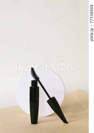 Isolated mascara on neutral backfround. Open with brush, black 77536908