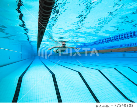 swimming in the pool at the swimming stadium 77540308