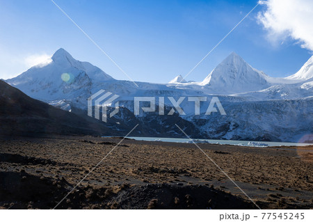 Snow mountains under blue sky in tibet,China 77545245