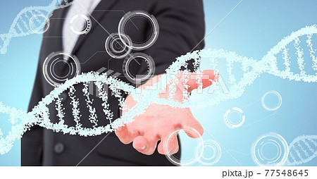 Dna structure and round scanners over mid section of business man with cupped hand 77548645