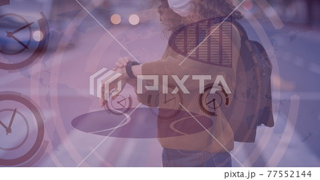 Mid-section of caucasian women looking at her watch with clock digital background 77552144