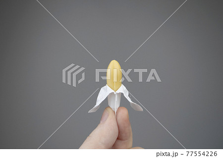 Vaginal or rectal candle in hands on a light background. The drug is in the form of suppositories. The concept of treatment of gynecological diseases and diseases of the rectum 77554226