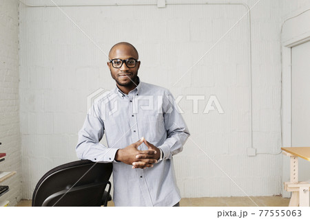 Portrait of young man in design office 77555063