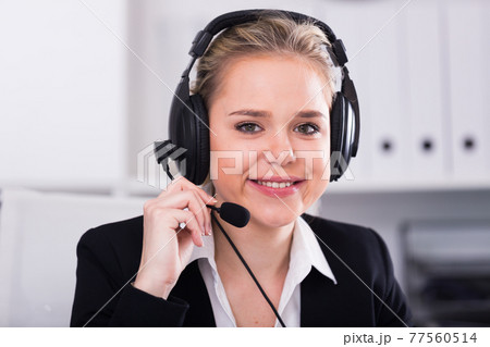 Female call center operator working Female call center operator working 77560514