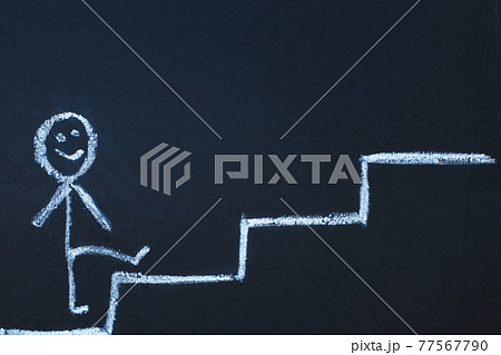 drawn man on the chalk board climbs up step by step to the top of career stairs. copy space drawn man on the chalk board climbs up step by step to the top of career stairs. copy space 77567790
