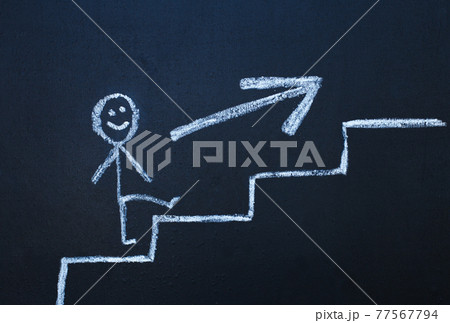 drawn man on the chalk board climbs up step by step to the top of career stairs. copy space 77567794