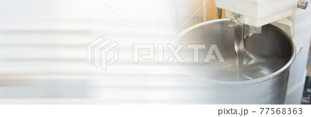 Stand mixer on a kitchen counter, restaurant kitchen and food industry concepts 77568363