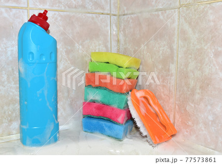 Detergent bottle and sponge during cleaning bathroom or toilet. anti-bacterial liquids Detergent bottle and sponge during cleaning bathroom or toilet. anti-bacterial liquids 77573861