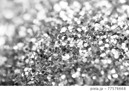 Beautiful Festive glitter of sparkles. Macro. Abstract black and white background 77576668