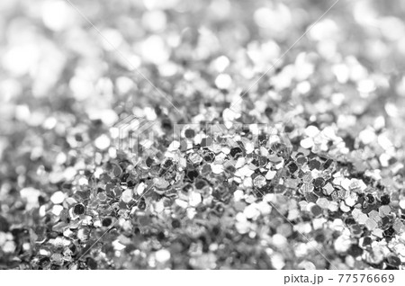 Beautiful Festive glitter of sparkles. Macro. Abstract black and white background 77576669