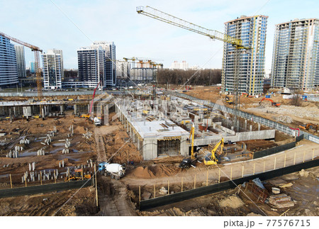 Drone view of a large construction site. Tower cranes in action. Housing renovation concept.  77576715