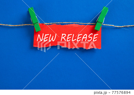 Hanging torn paper with new release word 77576894