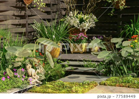 the statue in garden,  a small Landscaped Gardens 77589449