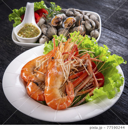 Seafood grilled on white plate 77590244