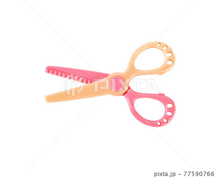 Plastic children safety scissors isolated on a white studio background. 77590766