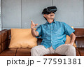 asian senior man enjoying when wearing VR headsets(vintage tone) 77591381