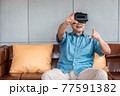 asian senior man enjoying when wearing VR headsets(vintage tone) 77591382