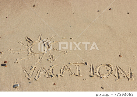 Inscription vacation and shape of sun on sand at beach. Summer time Inscription vacation and shape of sun on sand at beach. Summer time 77593065