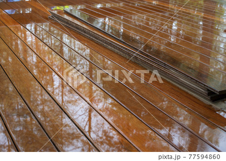 Ipe wood plank terrace on rainy day. Ipe wood plank terrace on rainy day. 77594860
