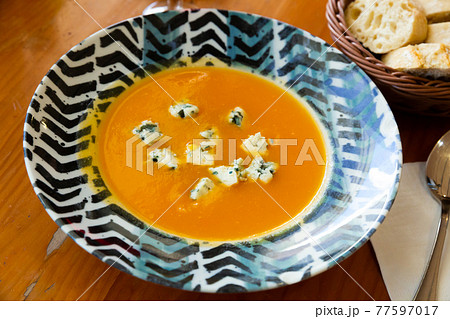Creamy carrot soup with gorgonzola Creamy carrot soup with gorgonzola 77597017